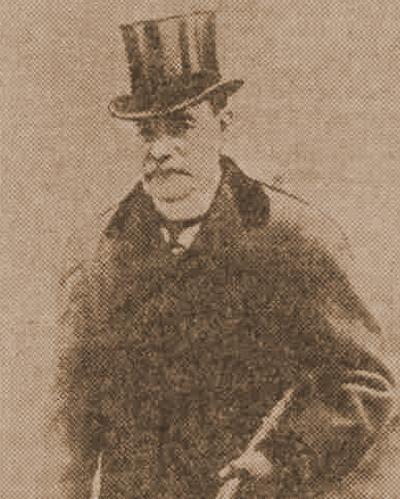 A photograph of Sir Melville Macnaghten in a top hat in 1913.