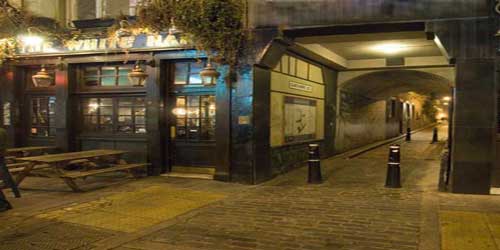 A photograph of the White Hart Pub on Whitechapel High Street.