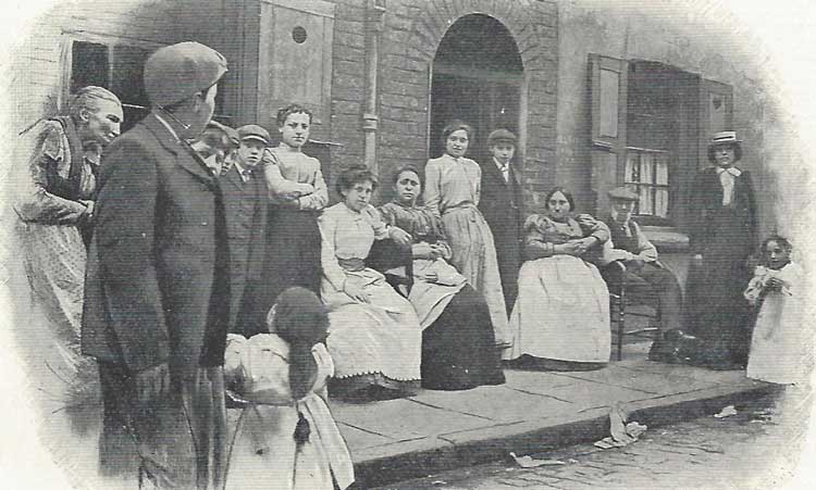 Jewish East End residents outside their houses.