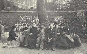 People sitting on a bench in the park.